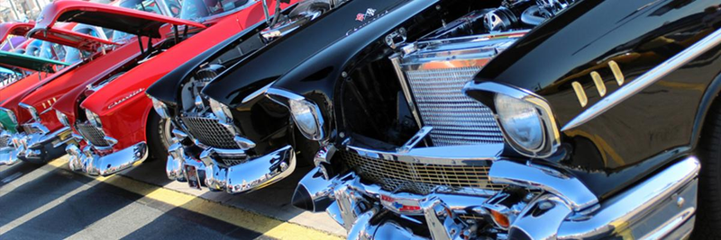 Tri-five Chevy row at a car show safety picture